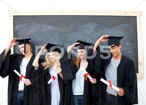 Group of teenagers celebrating after Graduation Stock Photos