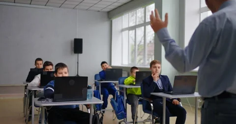 Group Of Teens Boys Studying In School, Teacher And Pupils In Modern Computer Stock Footage 280180639