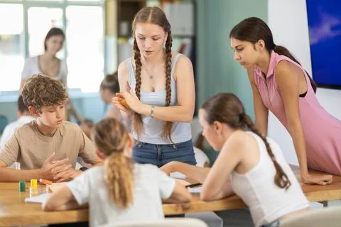 Group of teens playing board game. Stock Photos