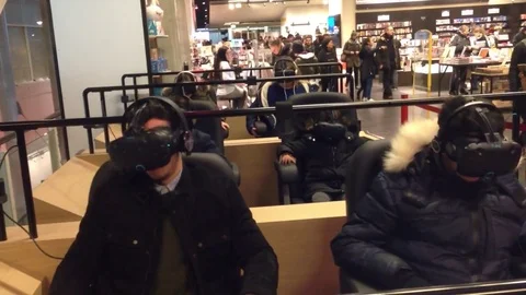 Group Teens Using Virtual Reality Headphones in Paris Cinema Stock Footage 71084156