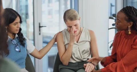 Group therapy, crying and support with woman, empathy or understanding with.. Stock Photos