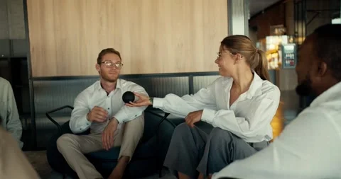 Group therapy for office workers. People in a company take turns expressing Stock Footage 247050834