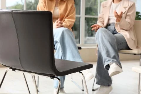 Group therapy session with people sitting in chairs, Mental health support an Stock Photos