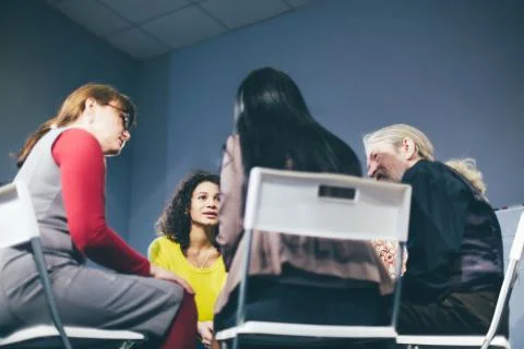 Group therapy session sitting in a circle Stock Photos