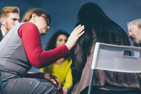 Group therapy session sitting in a circle Stock Photos