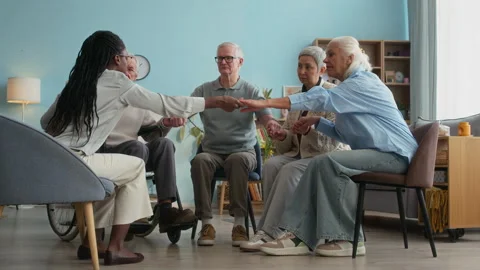 Group Therapy Unity Exercise in Nursing Home Video stock 306924230