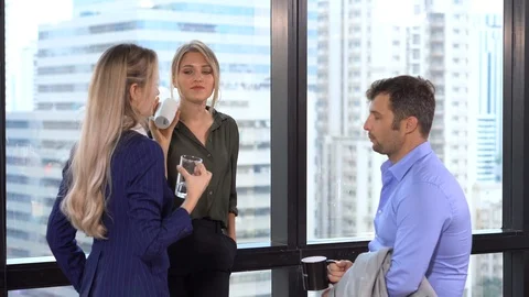 Group of three business people standing on the window in office meeting and d Stock Footage 112730095