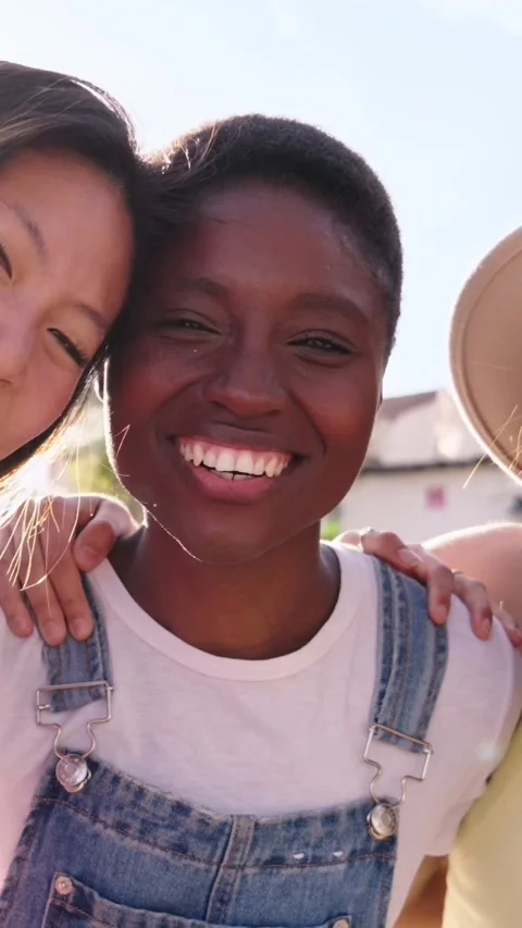Group three cheerful young multiracial beautiful women looking at smiling camera Stock Footage 274492537