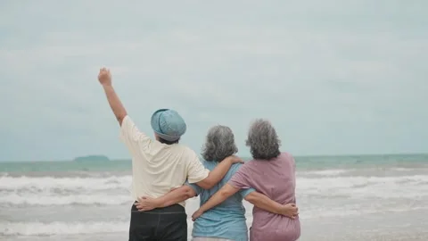 Group of Three Elderly Female Friends Laughing, Hugging, Enjoying on the Beach Stock Footage 314063232