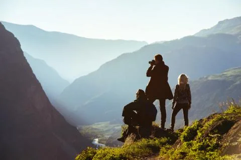 Group of three friends in mountains range 스톡 사진