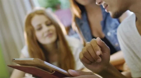 A group of three hipster fun using a tablet computer Stock Footage 54937906