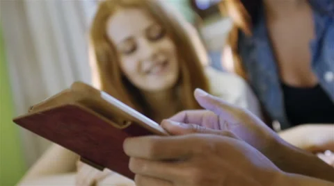 A group of three hipster fun using a tablet computer Stock Footage 54937934