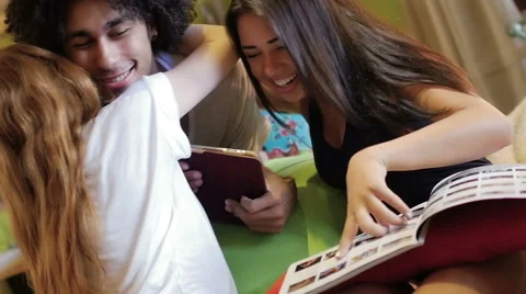 A group of three hipster fun using a tablet computer Stock Footage 54938874