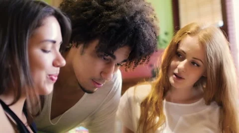 A group of three hipster fun using a tablet computer Stock Footage 54938974