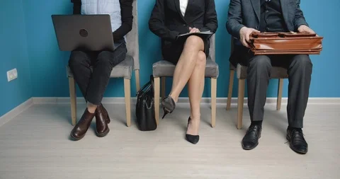 Group of three people waiting in queue line for meeting Stock Footage 125499096