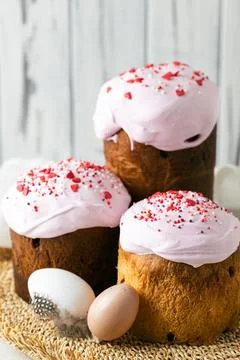 Group of three traditional Easter bread with pink icing and sprinkles 스톡 사진