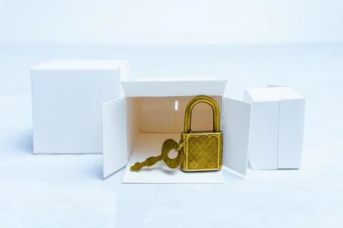 Group of tiny boxes and keyed padlock Foto stock