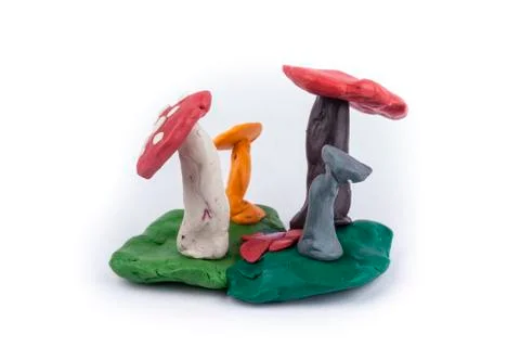 Group of toadstools fashioned from clay isolated on white Stock Photos