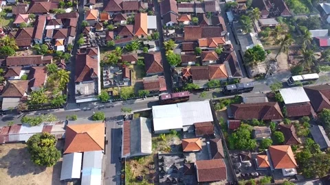 A group of tourist buses passing through Ubud village, Bali Stock Footage 285835551