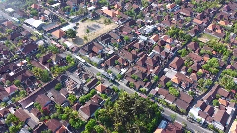 A group of tourist buses passing through Ubud village, Bali Stock Footage 285835581