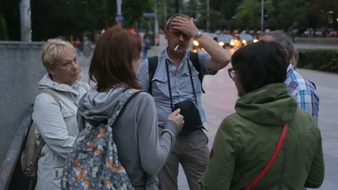 Group of tourist deciding which direction to go Stock Footage 96097873