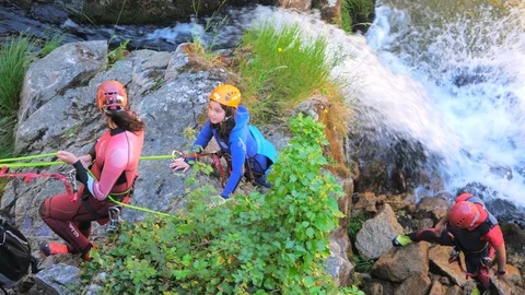 Group Of Tourist With Instructor Rappelling A Waterfall Stock Footage 91995857