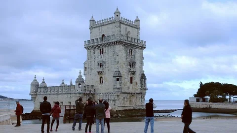 Group of tourists at Belem tower on the River Tejo bank in Lisbon, Portugal Stock Footage 112666871