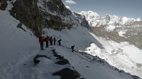Group of tourists coming down from the Renjo Pass. Himalayas, Nepal. FULL HD Video stock 40571129