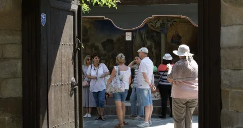 Group of tourists doing a guided tour at the old town of Plovdiv Stock Footage 93893061