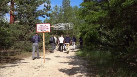 Group of tourists enter prohibited area of the Duga Stock Footage 78019142