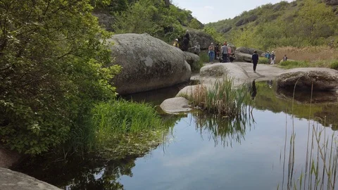 Group of tourists on the excursion in Granite-steppe lands of Buh park Stock Footage 108224665