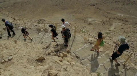 Group of tourists go down from high mountain. Stock Footage 51102074