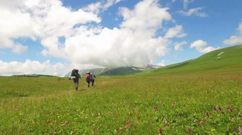 A group of tourists is going to the mountains Stock Footage 68355585