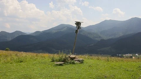 A group of tourists looking for a road in the mountains with a pointer and phone Stock Footage 78501993