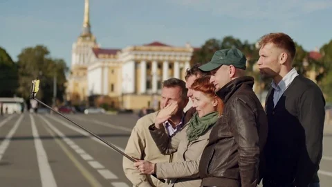Group of tourists make selfie on a background of historic center 스톡 동영상 69920269