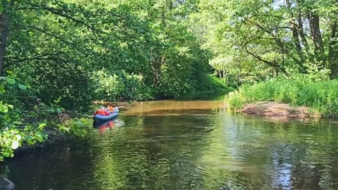 A group of tourists rafting on the river Stock Footage 235051798