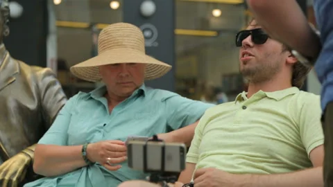 Group of tourists resting on bench Stock Footage 96355223