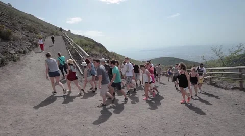 Group of tourists rises on Mount Vesuvius. Stock Footage 68032084
