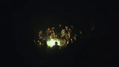 Group of tourists sing at the fireplace Stock Footage 105083727