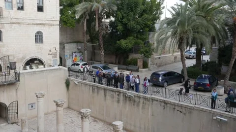 Group of Tourists with Tour Guide Overlooking Historical Site Stock Footage 57480908