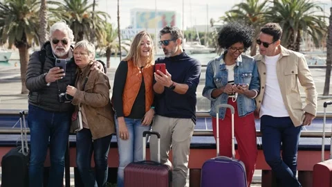 Group of tourists using cell phones in the city - Family friends traveling with Stock Footage 256014964