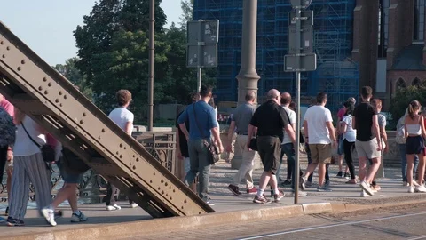Group Of Tourists Walking on a Bridge in Old European City Stock Footage 114983231