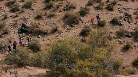 A group of tourists is walking in the mountains. Stock Footage 138675967