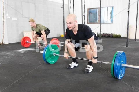 Group trains deadlift at crossfit center Stock Photos