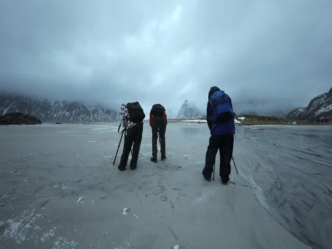 Group of travel photographers doing pictures in the shores of Norwegian Sea. Stock Footage