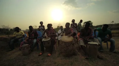 Group of tribes playing drum and dancing in field, Ghana Stock Footage 62388298