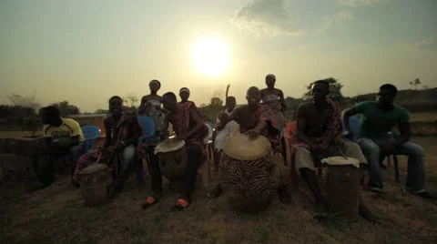 Group of tribes playing drum and dancing in field, Ghana Stock Footage 62388317