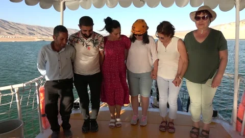 Group of Turkish men and women dancing folk dance on boat Stock Footage