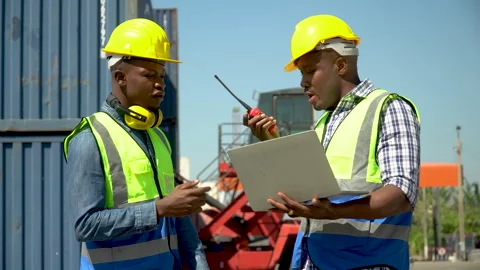 Group of two african american engineer  holding laptop computer talking wit.. Stock Footage 241718969