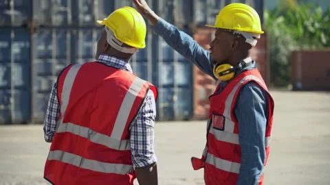 Group of two african american engineer  holding tablet  computer talking wi.. Stock Footage 242308391